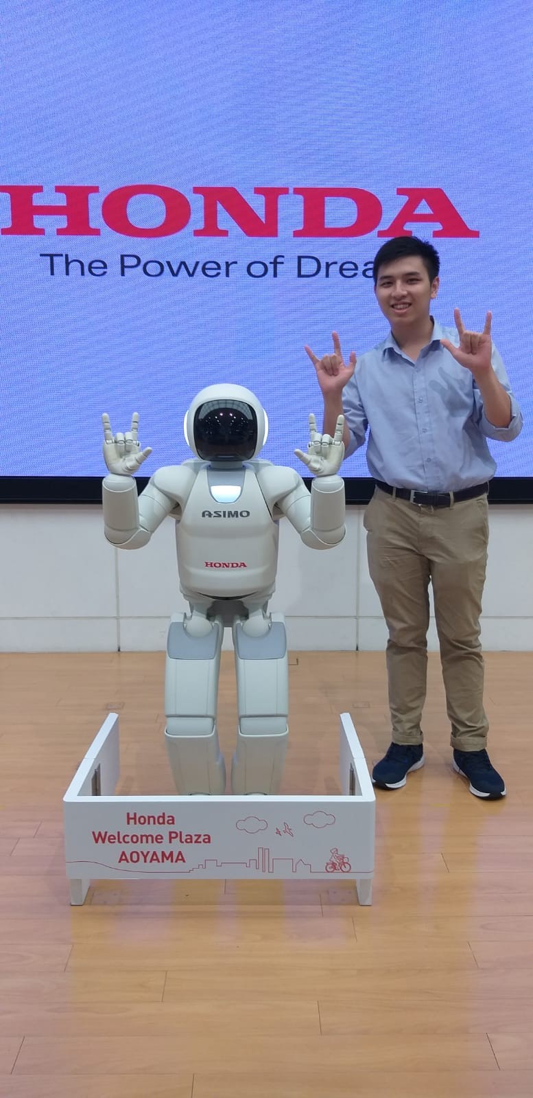 Photo of Ken with a robot